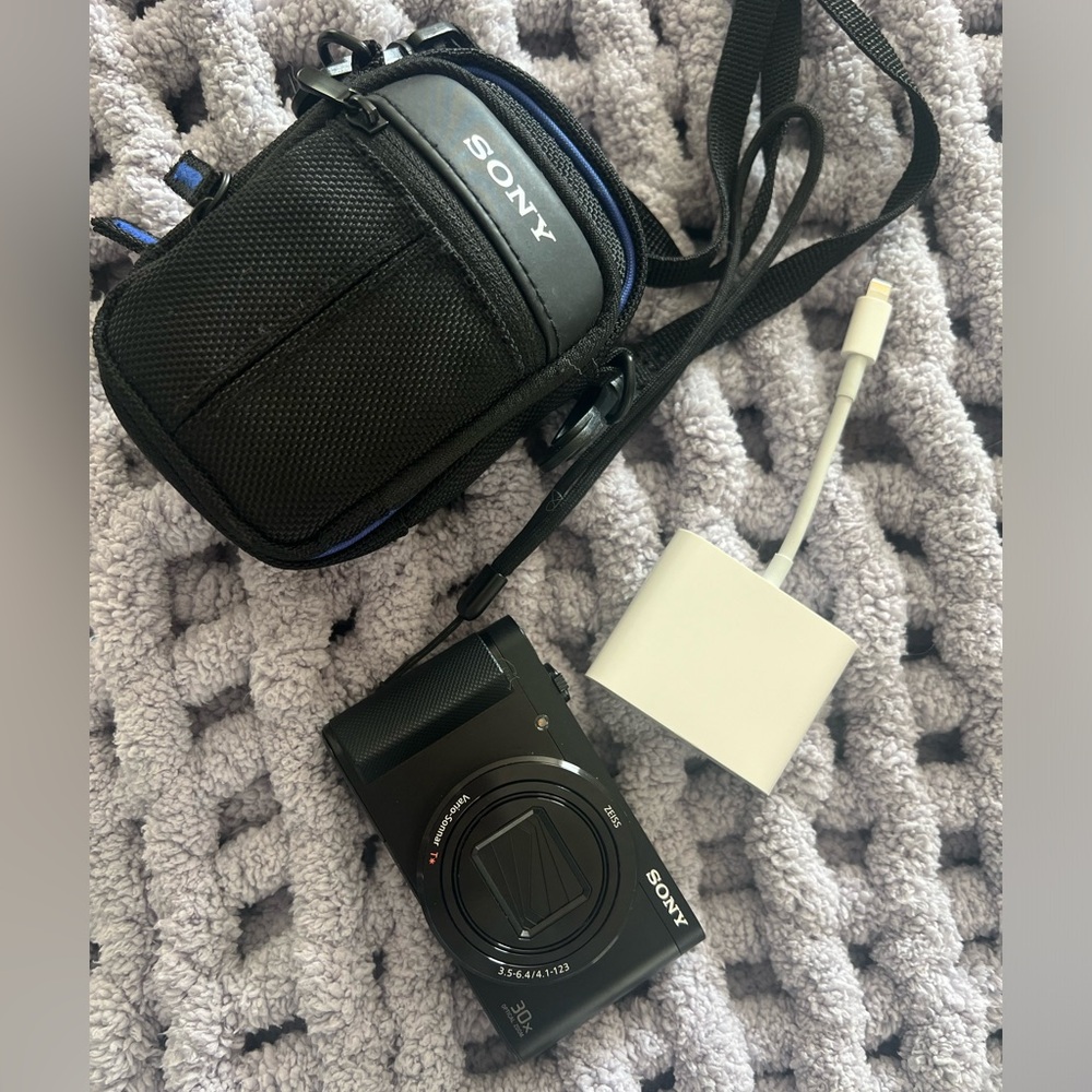 Sony camera with 2 batteries, charger, carrying case, 8 GB memory card, &adapter